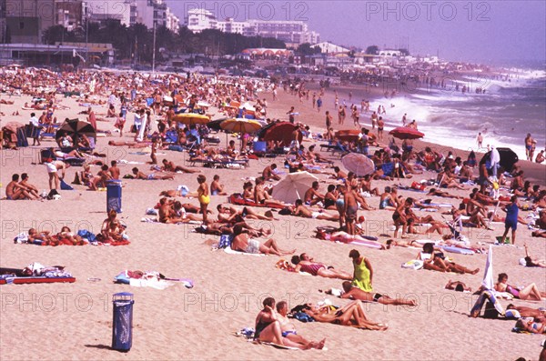 Crowded beach with sunbathers in Calella, Costa Brava, Barselona, ??Catalonia, Spain, Southern