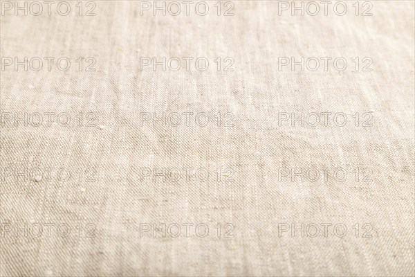 Fragment of smooth white linen tissue. Side view, natural textile background and texture