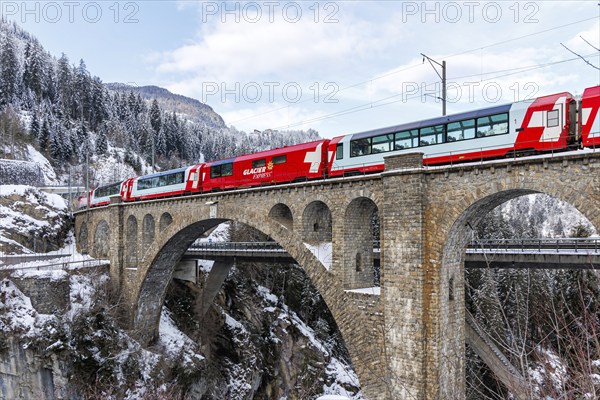 Glacier Express train of the Rhaetian Railway at the Solis viaduct of the Albula railway in the