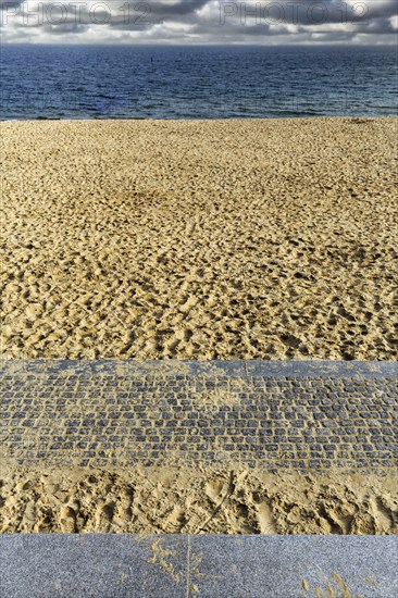 View from the empty sandy beach to the sea and cloudy sky, sunny autumn weather, full format, Wyk