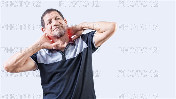 Neck pain and stress concept. Elderly person suffering with neck pain isolated. Mature man with