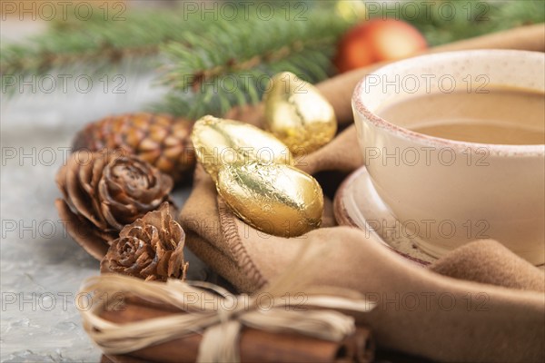 Christmas or New Year composition. Decorations, cones, cinnamon, fir and spruce branches, cup of