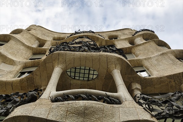 Artfully designed façade, balconies with wrought-iron grilles, view from below, Casa Mila, Casa