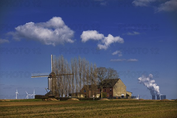 Historic Düppelsmühle, trestle windmill on a ridge near Titz in front of the Neurath power station,