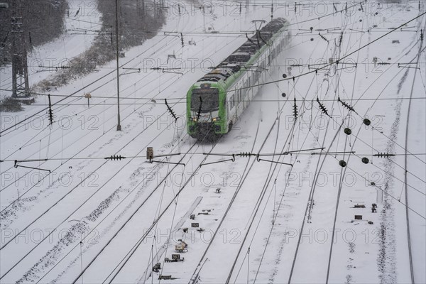 Onset of winter with lots of fresh snow and temperatures below -5 degrees during the day, railway