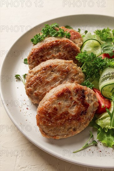 Fried cutlets, turkey, with vegetable salad, top view, no people