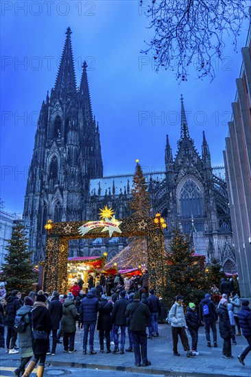 Christmas market at Roncalli Platz am Dom, in the city centre of Cologne, Sunday shopping in