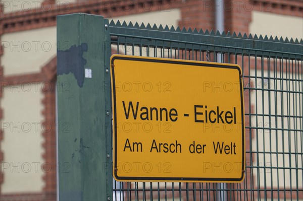 Sign on a building, Wanne-Eickel Am Arsch der Welt, belongs to the city of Herne, Ruhr area, North