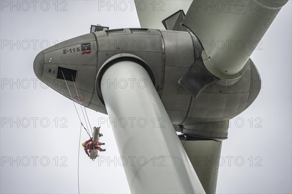 Height rescuers from the Oberhausen professional fire brigade practise abseiling from a wind