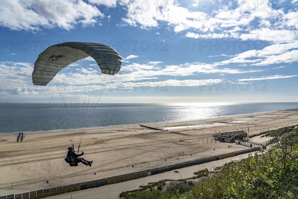 Paragliders along the dunes of Zoutelande, in Zeeland, South Holland, Netherlands