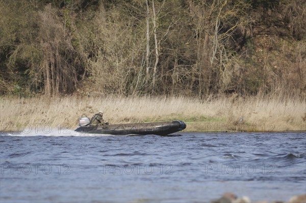 A Czech soldier crosses the Elbe in an inflatable boat as part of the military exercise 'Wettiner