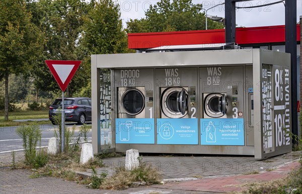 Self-service washing machines, for laundry, clothing, open 24 hours, around the clock, at a petrol