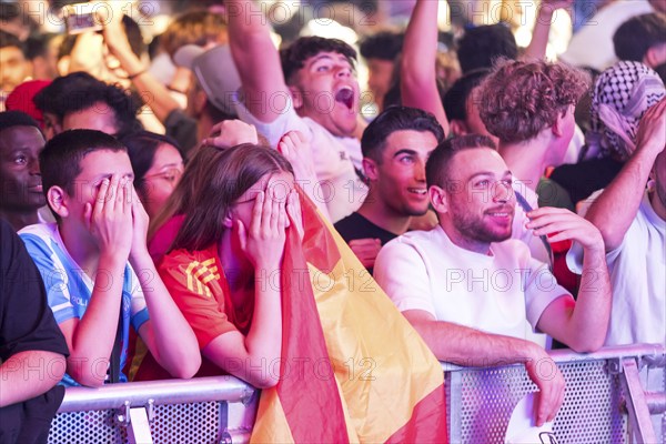Fans of the Spanish team fear after the equalising goal by England at the Adidas fan zone at the
