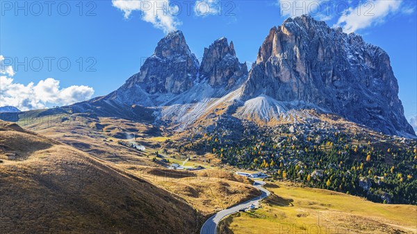 The peaks of the Sassolungo Group, Passo Sella, drone shot, Val Gardena, Dolomites, Autonomous