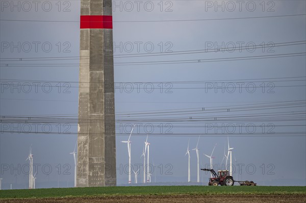 Wind farm north-east of Bad Wünnenberg, near the village of Elisenhof, farmer working in the field