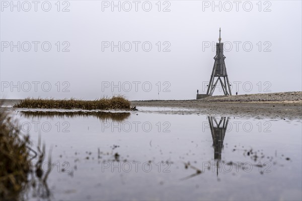 Thick fog in winter, hangs over the mouth of the Elbe into the North Sea, navigation mark and
