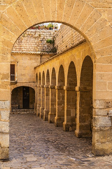 Archway and arcades at the Portal de des Tales in the old town of Eivissa, Ibiza Town, Ibiza,