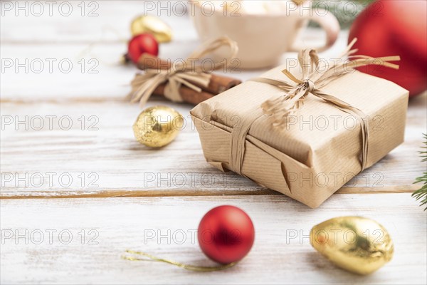 Christmas or New Year composition. Decorations, box, red balls, cinnamon, fir and spruce branches,