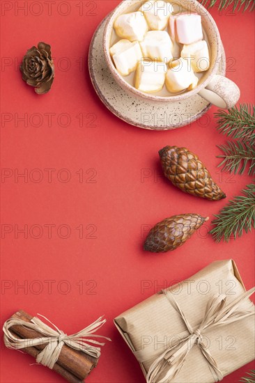 Christmas or New Year composition. Decorations, box, cinnamon, cones, fir and spruce branches, cup