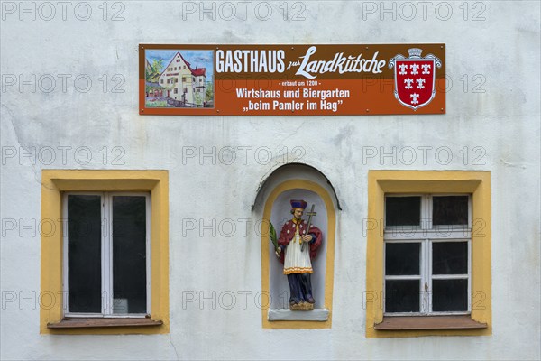 Figure of St Nepomuk in a niche at an inn, Sulzbach-Rosenberg, Upper Palatinate, Bavaria, Germany,
