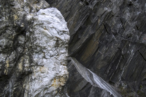 White quartz vein in rock face at the Ballachulish slate quarry in Lochaber, Highland, Scotland, UK