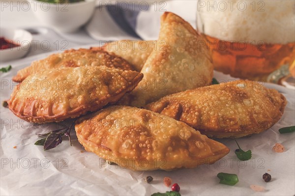 Fried chebureks, close-up, on a light background, no people