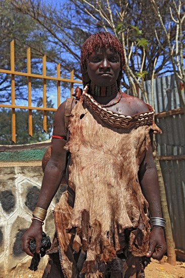 Southern Ethiopia, woman of the Hammer people in Dimeka, dress made of goatskin and hair dyed with