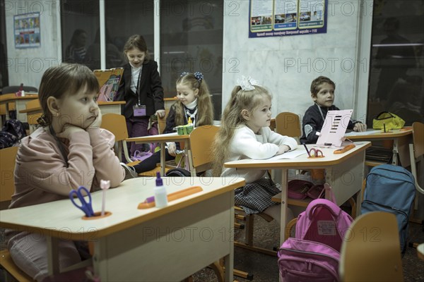 Pupils in a classroom in one of the metro schools in Kharkiv. Classrooms were set up in various