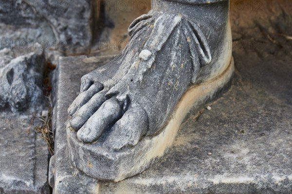 Close-up of the base of an ancient stone statue, exterior, Archaeological Museum, Archea Korinthos,