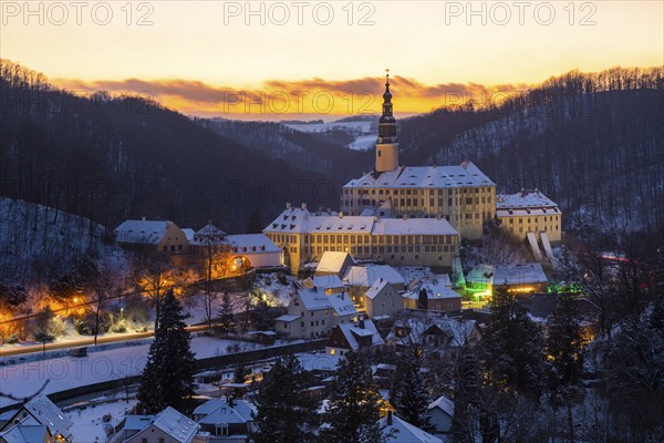 Winter evening in the Müglitz valley, impressively illuminated Weesenstein Castle at the blue hour,