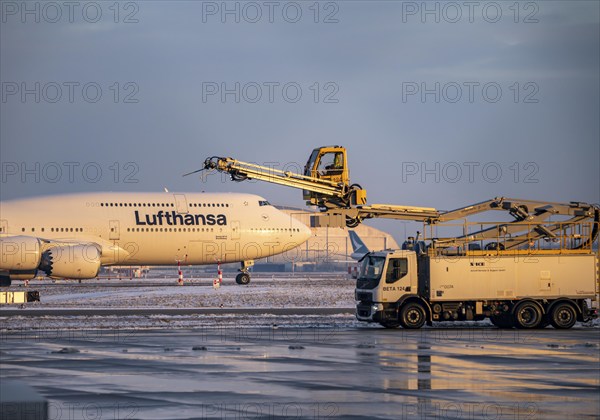Winter at Frankfurt Main Airport, FRA, de-icing vehicles waiting for aircraft to be de-iced, Hesse,