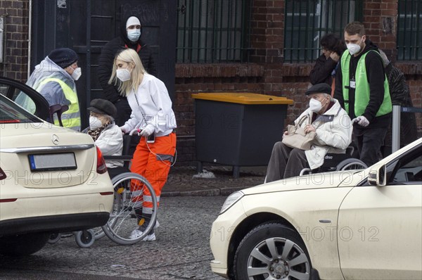Vaccinees are taken to taxis after vaccination in the arena in Treptow, Berlin, 09/02/2021