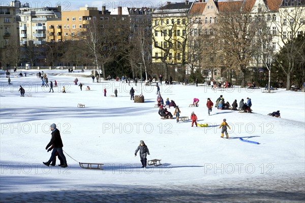 Tobogganing fun in Berlin's snow-covered Viktoriapark. Snow and icy cold continue to dominate the
