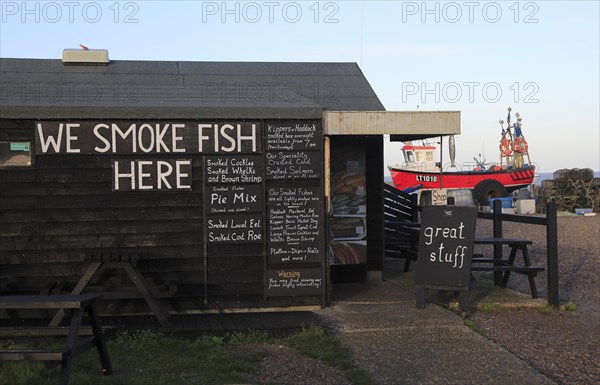 Sheds selling fresh and smoked fish on the beach at Aldeburgh, Suffolk, England, UK