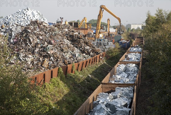 Scrap metal recycling loading train wagons with processed metals, EMR company, Swindon, England, UK