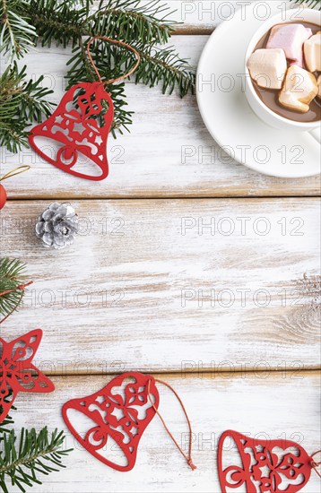 Christmas or New Year frame composition. Decorations, red stars, bells, cones, fir and spruce
