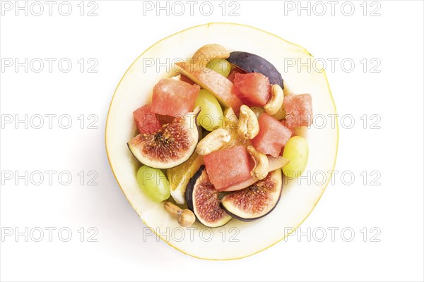 Vegetarian fruit salad of watermelon, grapes, figs, pear, orange, cashew isolated on white