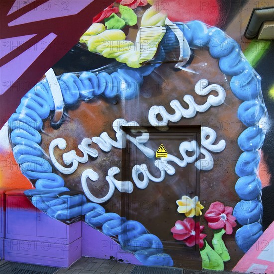 Graffiti of a gingerbread heart with the inscription Gruss aus Crange on a 10 KW station of
