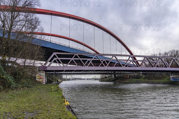 Dilapidated A42 motorway bridge (red arches) over the Rhine-Herne Canal, with massive structural