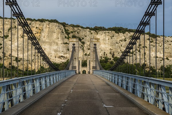 Old suspension bridge over the Rhone and rocks, Passerelle Marc Seguin, Tain-l'Hermitage,