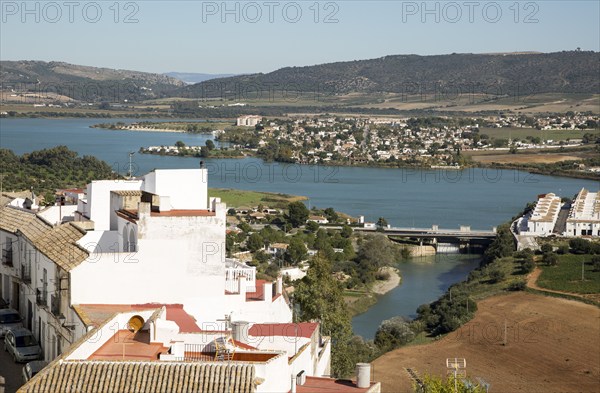 Reservoir lake occupying flooded valley land, village of Arcos de la Frontera, Cadiz province,