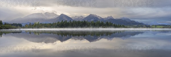 Sunrise, Lake Hopfensee, near Füssen, Ostallgäu, with the Tannheim Mountains behind, Allgäu,
