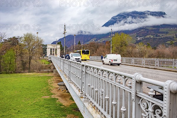 The Talfer Bridge with a view of the Victory Monument in Bolzano, South Tyrol, Italy, Europe