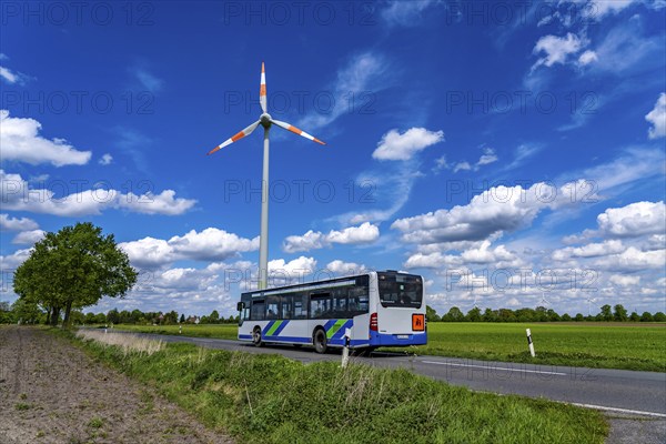 Wind turbine, wind energy plant from the manufacturer Enercon, blue sky with many white clouds,