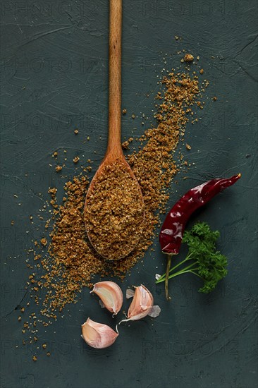 Svan salt, wooden spoon, garlic, red hot pepper, herbs and spices, Georgian cuisine
