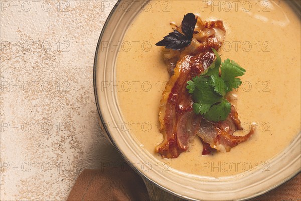 Pumpkin cream soup, curry, fried bacon, top view, no people