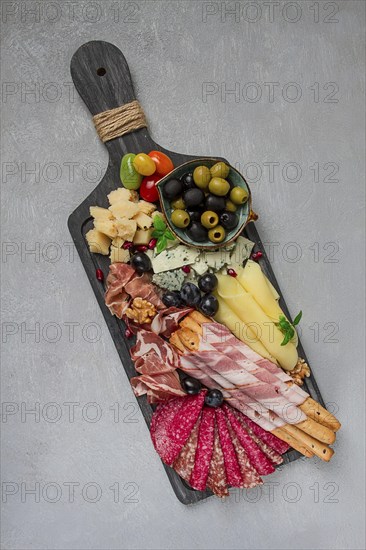 Appetizer, assortment, set, sausage, and cheese, on a wooden board, top view, no people