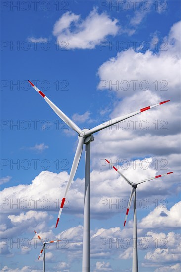 Wind turbine, wind energy plant from the manufacturer Enercon, blue sky with many white clouds,