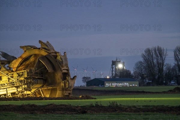 Two excavators are working around the hamlet of Lützerath, occupied by climate activists, the