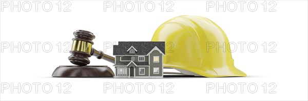 Miniature model house, yellow hard hat and gavel isolated on a white background